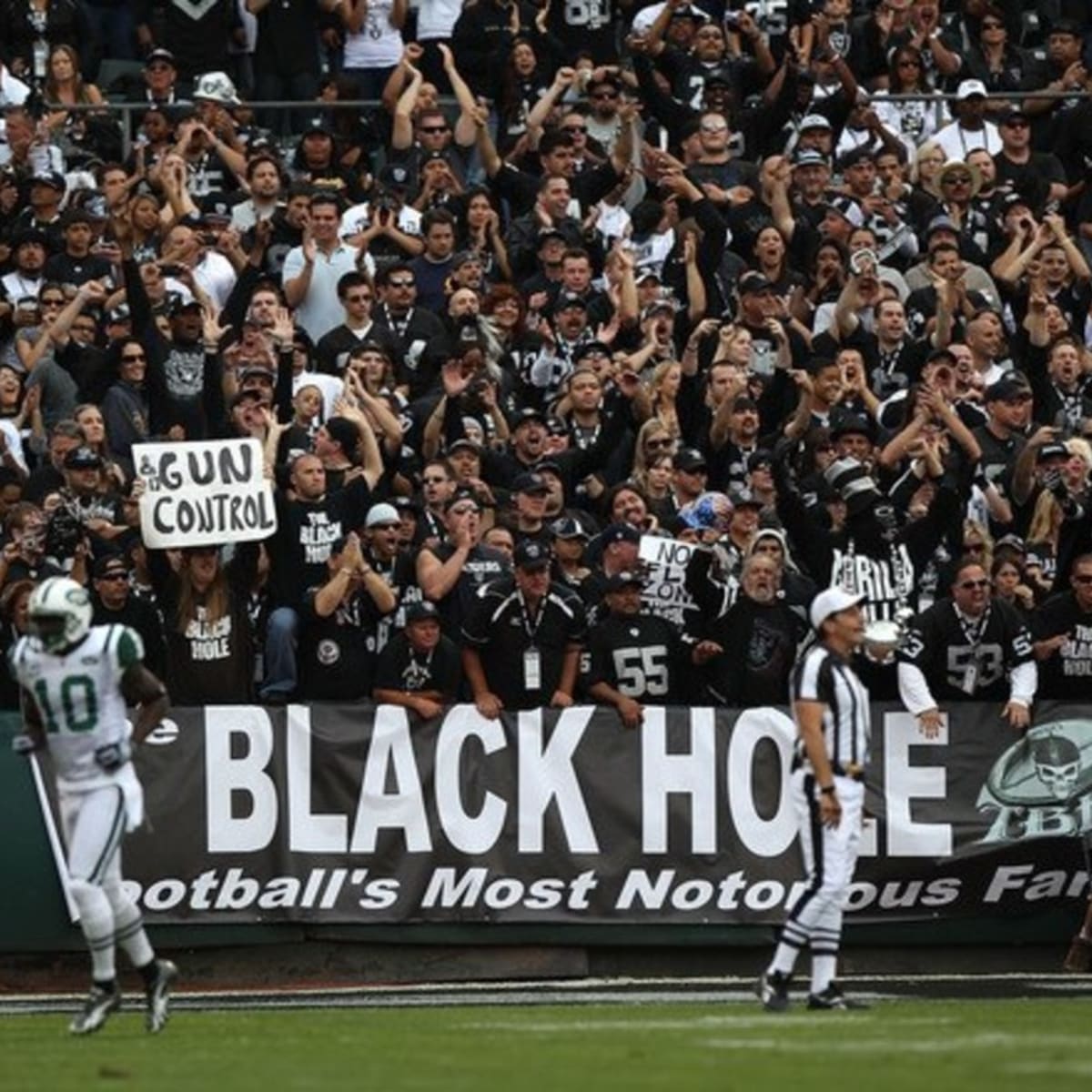 Unidentified Oakland Raiders fans watch their team go down to defeat  against the Houston Texans in an NFL football game, Sunday, Nov. 4, 2007 at  McAfee Coliseum in Oakland, Calif. The Texans