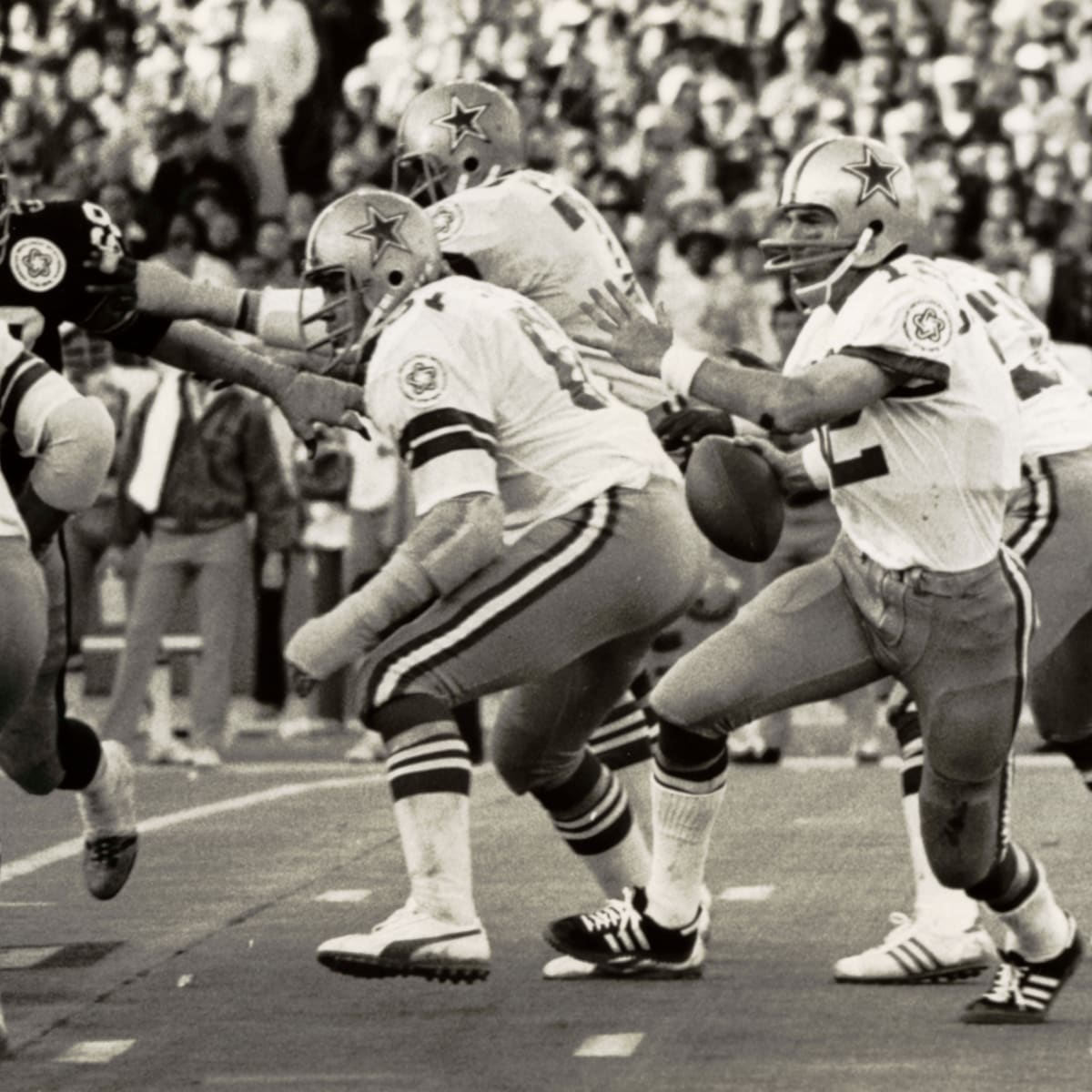 Quarterback Roger Staubach and Danny WHite of the Dallas Cowboys talk